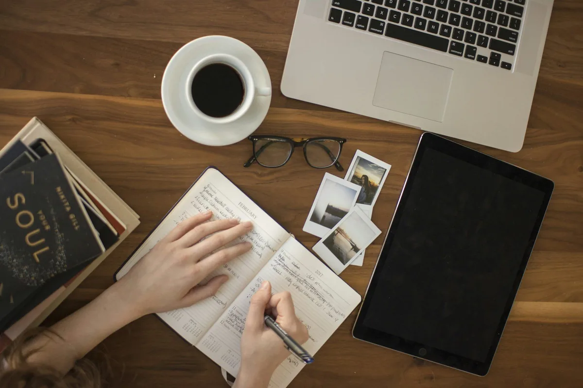 Laptop and handwritten notes used for GED practice